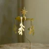 Roterend molentje met kersttakjes, metaal, goudkleurig